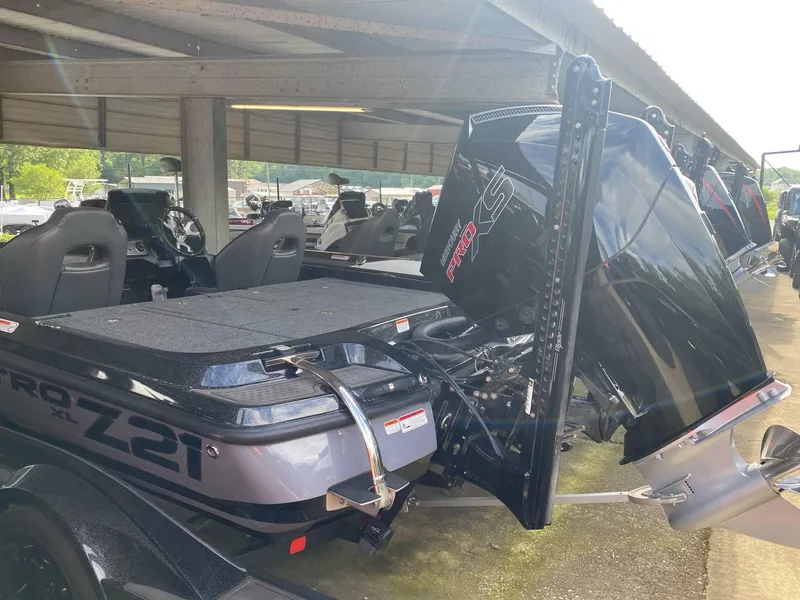 Slide: The Image of 2024 Nitro Z21 XL Pro boat with powerful engine, parked under a shelter. - 13