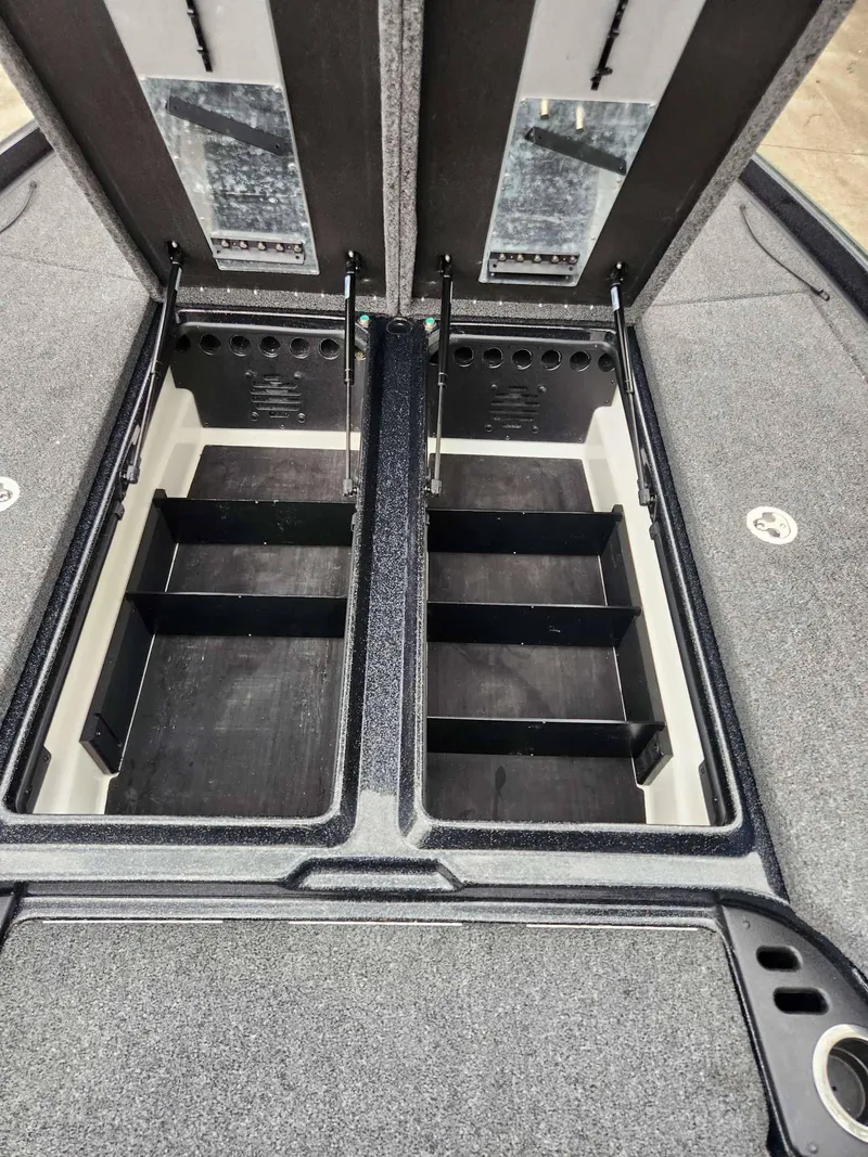 Slide: The Image of 2024 Nitro Z21 XL Pro boat storage compartments open on deck. - 17
