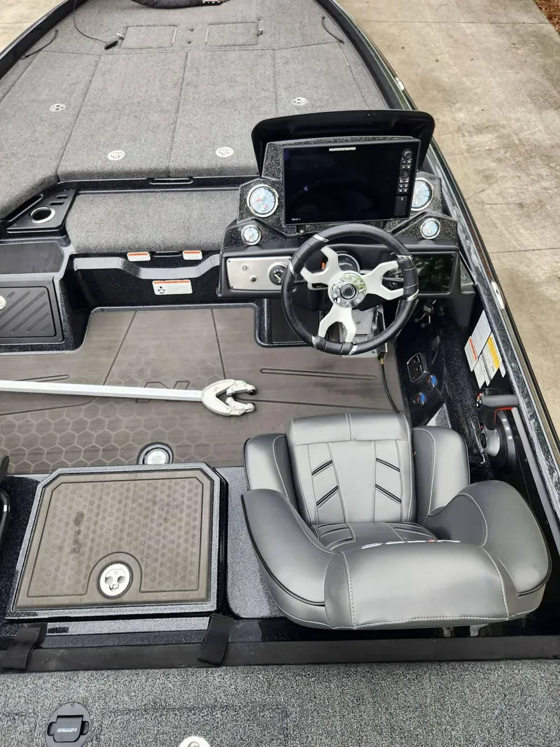 Slide: The Image of 2024 Nitro Z21 XL Pro boat interior with steering wheel and dashboard controls. - 18