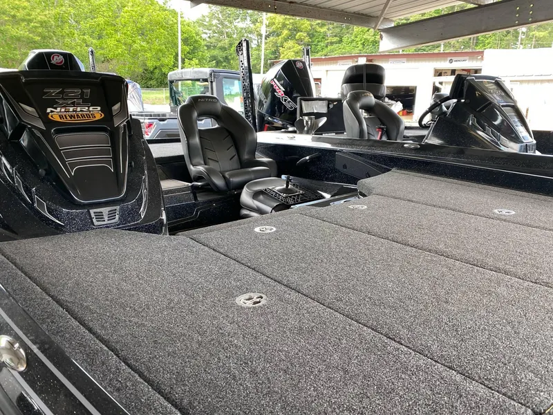 Slide: The Image of 2024 Nitro Z21 XL Pro boat interior with seating and storage compartments. - 20
