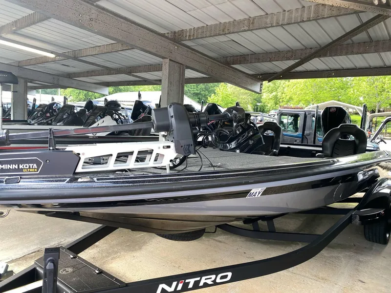 Slide: The Image of 2024 Nitro Z21 XL Pro boat displayed in a covered showroom. - 25