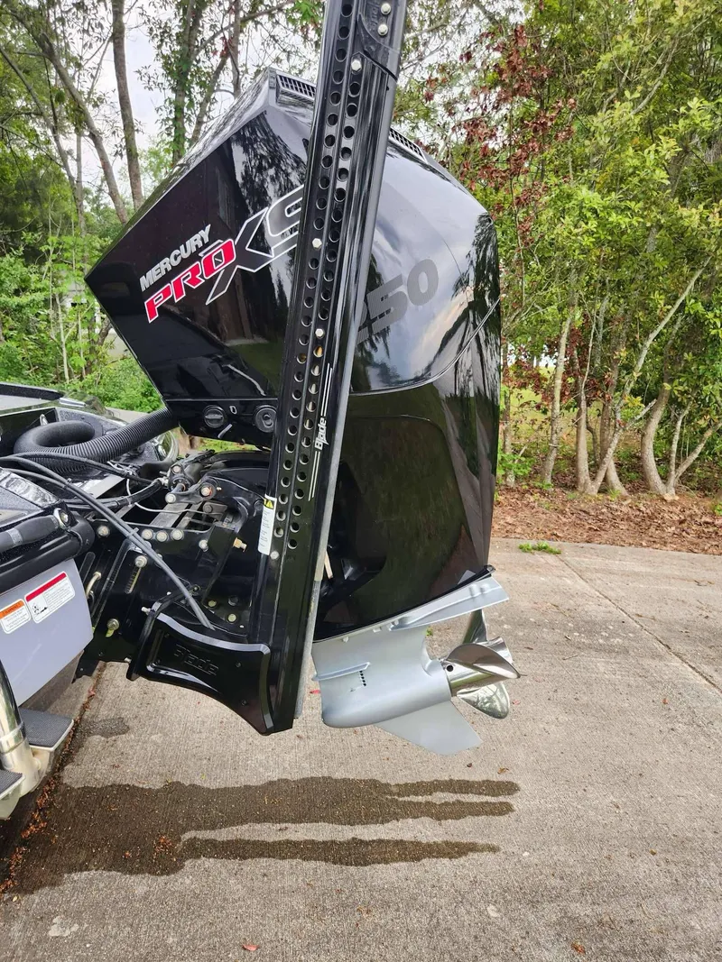 Slide: The Image of 2024 Nitro Z21 XL Pro boat with Mercury Pro XS engine, parked outdoors. - 5