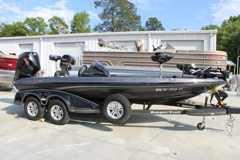 Slide: The Image of 2023 Ranger Z519 Ranger Cup Equipped boat on trailer, parked outdoors. - 0