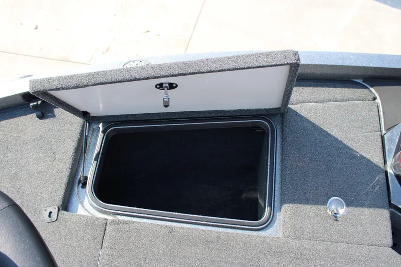 Slide: The Image of 2023 Ranger Z519 Ranger Cup Equipped boat storage compartment open, showcasing interior space. - 10