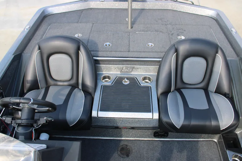 Slide: The Image of 2023 Ranger Z519 Ranger Cup boat interior with dual black and gray seats. - 15