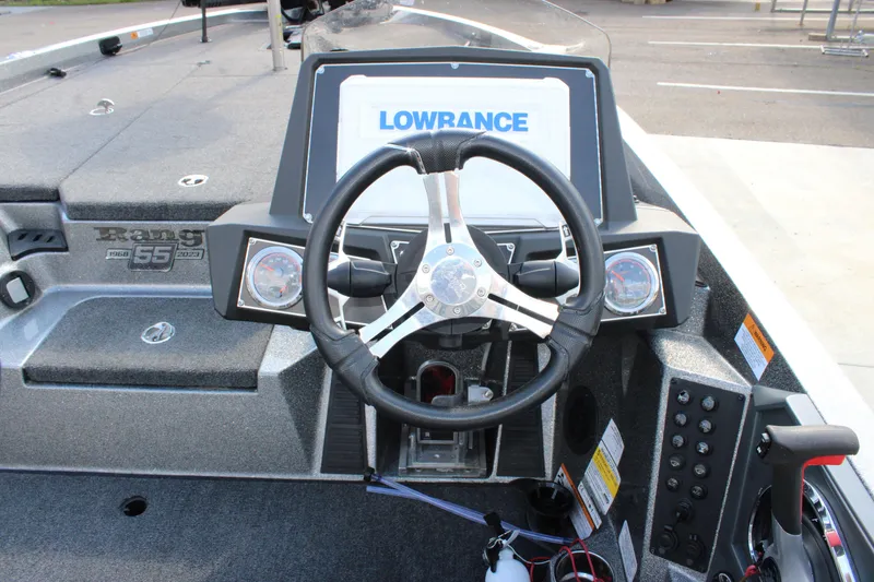 Slide: The Image of 2023 Ranger Z519 Ranger Cup boat dashboard with Lowrance display and steering wheel. - 16
