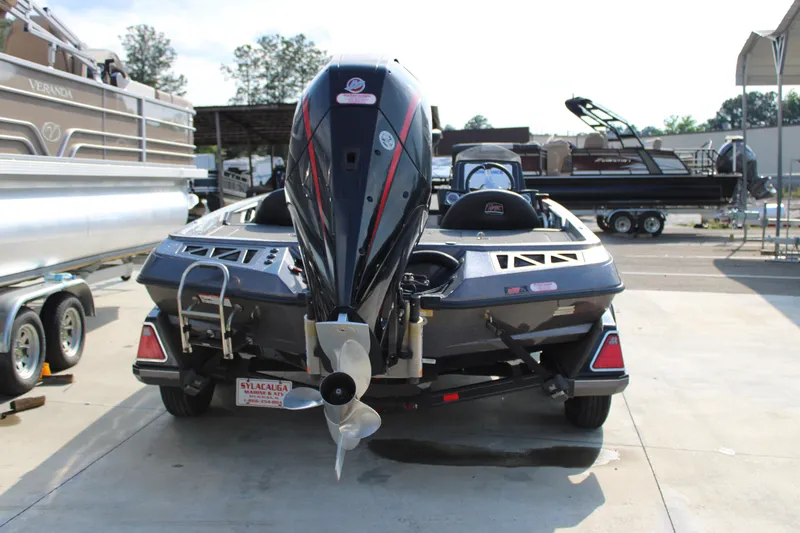 Slide: The Image of 2023 Ranger Z519 Ranger Cup Equipped boat, rear view, parked outdoors. - 2