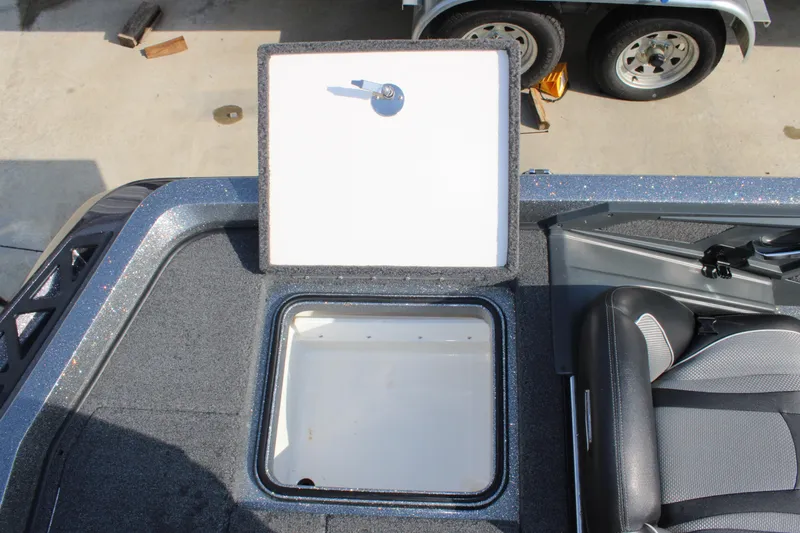 Slide: The Image of 2023 Ranger Z519 Ranger Cup Equipped boat storage compartment with open lid, showcasing interior space. - 21
