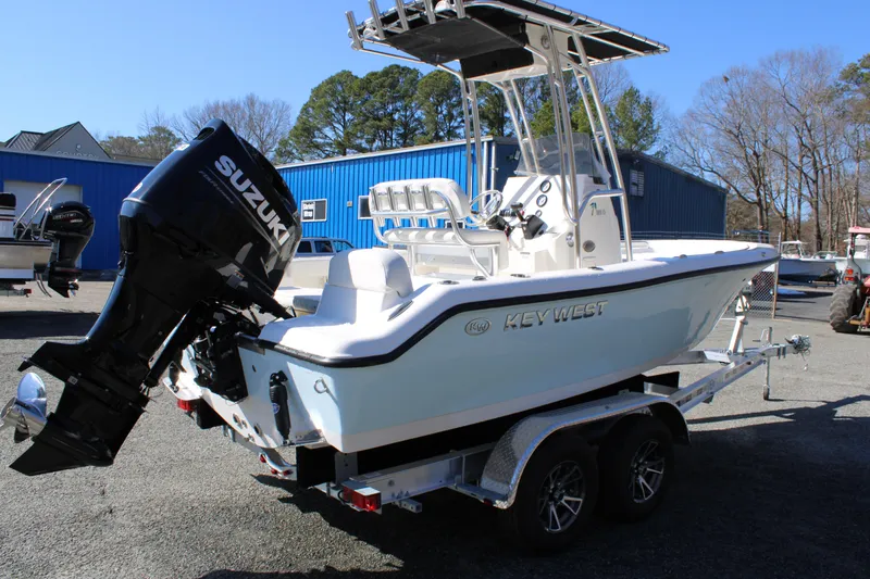 Slide: The Image of 2025 Key West 189 FS boat with Suzuki outboard motor on trailer. - 3