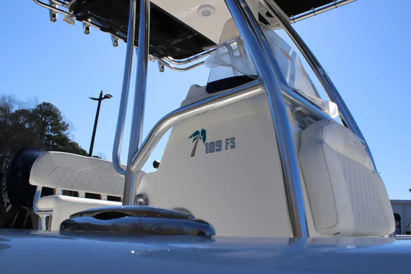 Slide: The Image of 2025 Key West 189 FS boat, sleek design, stainless steel details, clear blue sky background. - 4