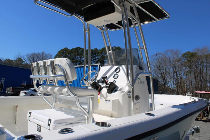 Slide: The Image of 2025 Key West 189 FS boat with center console and seating, docked outdoors. - 7