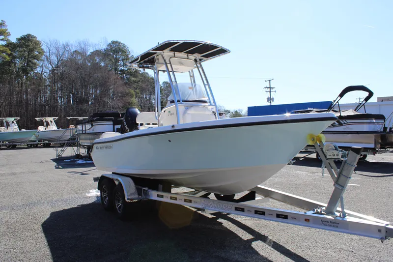 Slide: The Image of 2025 Key West 189 FS boat on trailer in outdoor lot, sunny day. - 8