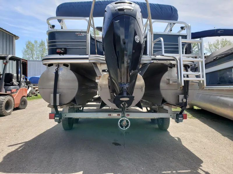 Slide: The Image of 2015 Lowe SF214 Sport Fish pontoon boat on trailer, rear view with outboard motor. - 2