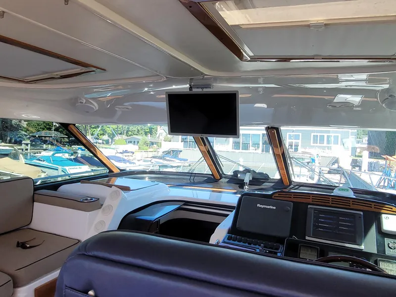 Slide: The Image of Interior of 2005 Tiara Yachts 4400 Sovran with navigation equipment and seating. - 15