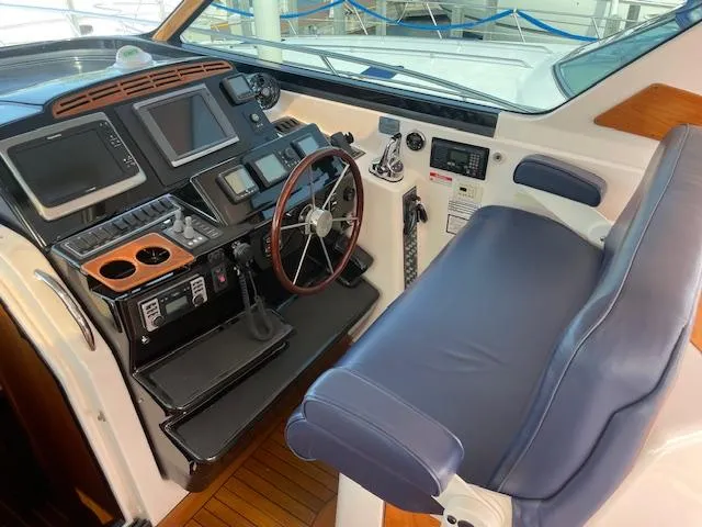 Slide: The Image of 2005 Tiara Yachts 4400 Sovran helm with advanced navigation controls and comfortable seating. - 20