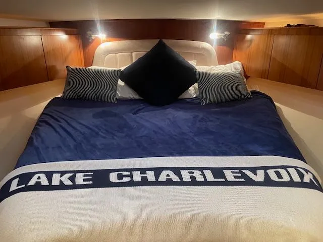 Slide: The Image of Luxurious cabin interior of 2005 Tiara Yachts 4400 Sovran with "Lake Charlevoix" blanket. - 36
