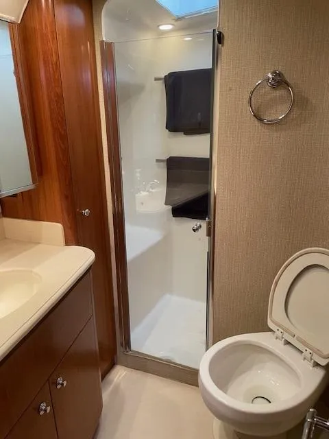 Slide: The Image of Bathroom interior of 2005 Tiara Yachts 4400 Sovran, featuring shower and toilet. - 45