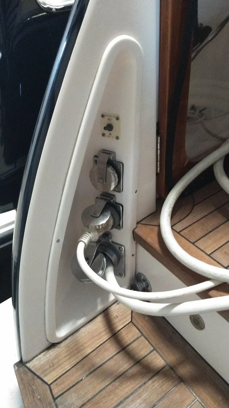 Slide: The Image of Power connections on a 2005 Tiara Yachts 4400 Sovran, featuring teak decking. - 59