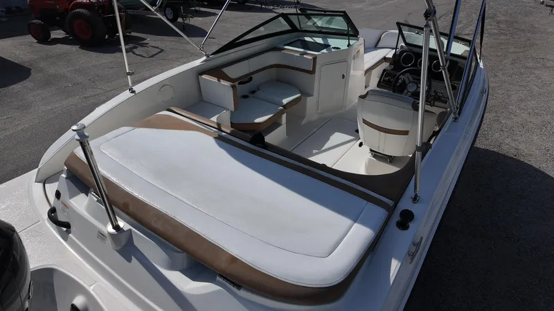 Slide: The Image of 2018 Sea Ray 190 Bow Rider boat interior with seating and dashboard. - 19