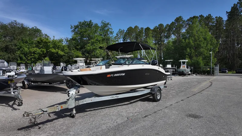 Slide: The Image of 2018 Sea Ray 190 Bow Rider on trailer in outdoor setting. - 2