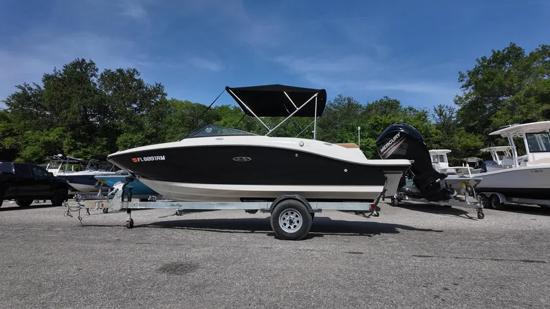 Slide: The Image of 2018 Sea Ray 190 Bow Rider boat on trailer, parked outdoors. - 20