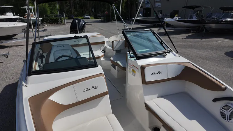 Slide: The Image of 2018 Sea Ray 190 Bow Rider boat interior with seating and steering wheel. - 3