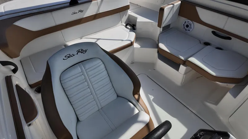 Slide: The Image of Interior of 2018 Sea Ray 190 Bow Rider boat with white and brown seating. - 4
