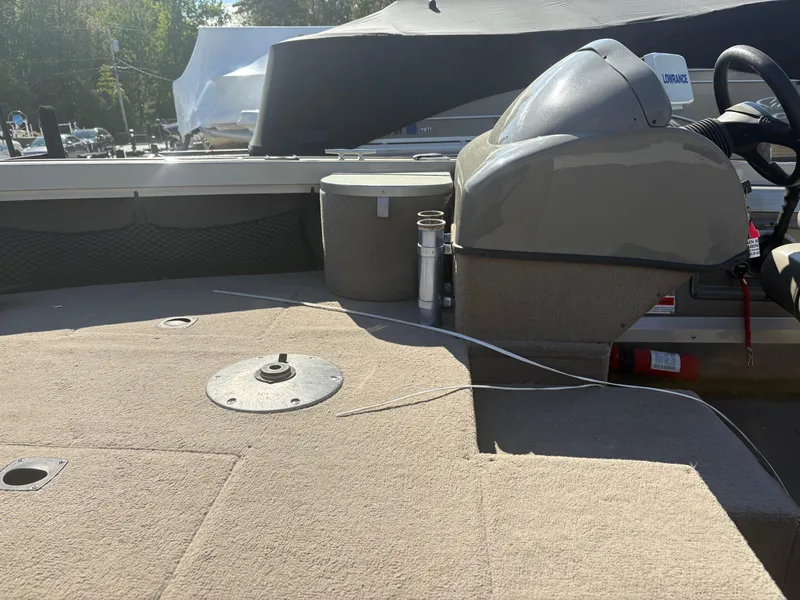 Slide: The Image of 2003 Tracker Targa 17 SC boat interior with steering console and seating area. - 11
