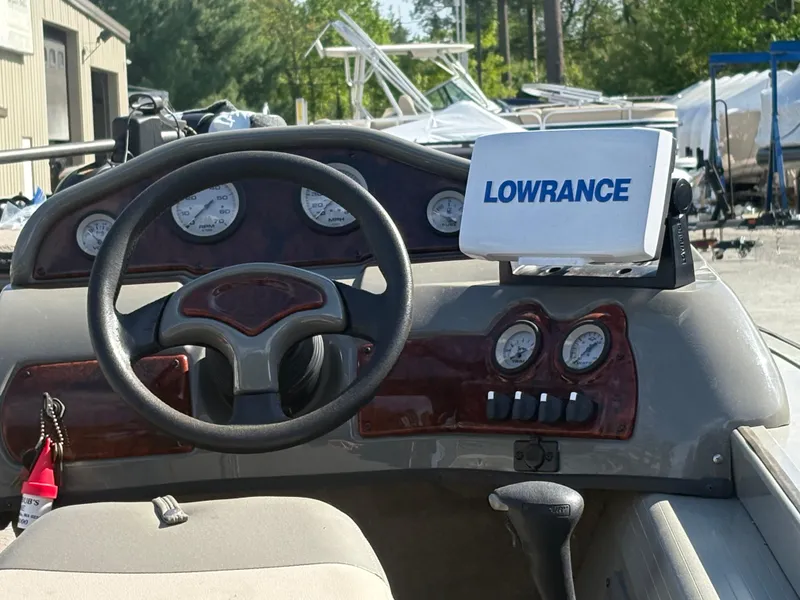 Slide: The Image of 2003 Tracker Targa 17 SC boat dashboard with Lowrance navigation system. - 4