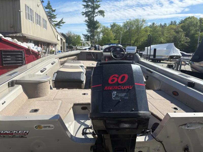 Slide: The Image of 2003 Tracker Targa 17 SC boat with 60 Mercury engine, docked outdoors. - 6