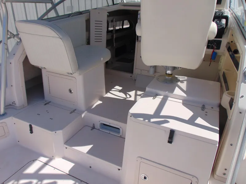 Slide: The Image of 2002 Grady-White 30 Marlin WA boat interior with seating and helm area. - 10