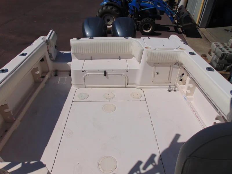 Slide: The Image of 2002 Grady-White 30 Marlin WA boat deck with seating and storage compartments. - 11