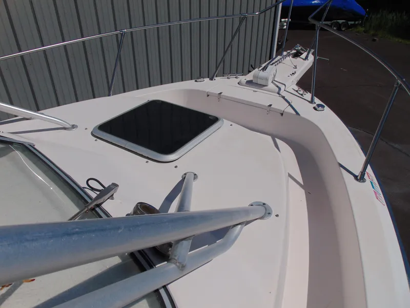 Slide: The Image of 2002 Grady-White 30 Marlin WA boat deck with railing and hatch. - 13