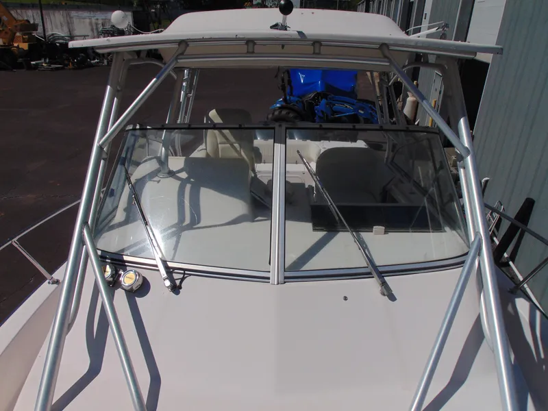 Slide: The Image of 2002 Grady-White 30 Marlin WA boat with windshield and metal frame. - 15