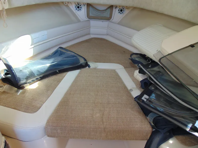 Slide: The Image of 2002 Grady-White 30 Marlin WA cabin interior with cushions and storage. - 22