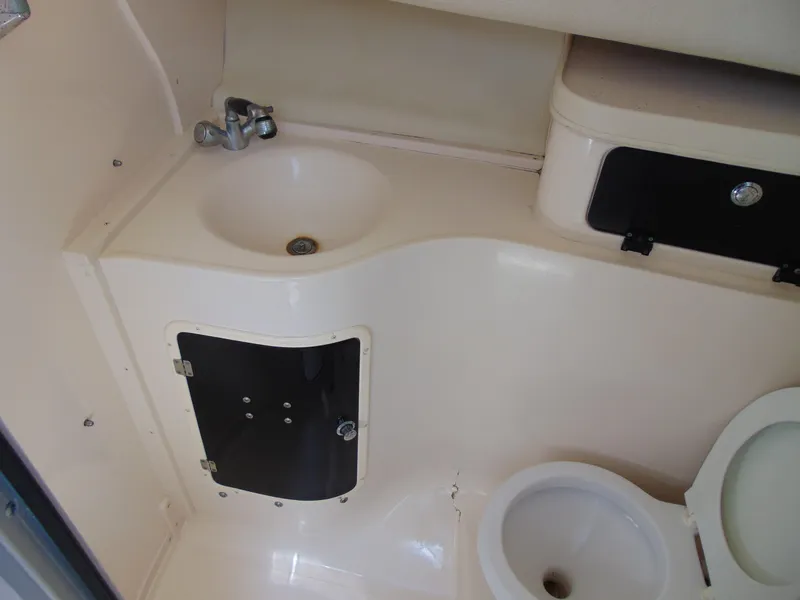 Slide: The Image of 2002 Grady-White 30 Marlin WA boat bathroom with sink and toilet. - 29