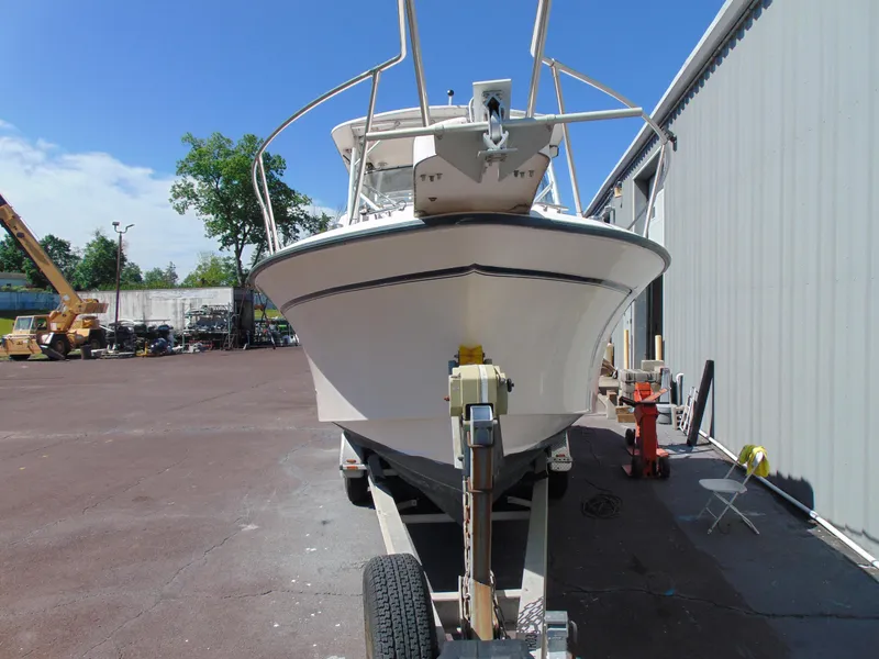Slide: The Image of 2002 Grady-White 30 Marlin WA boat on trailer, parked outdoors near a building. - 3