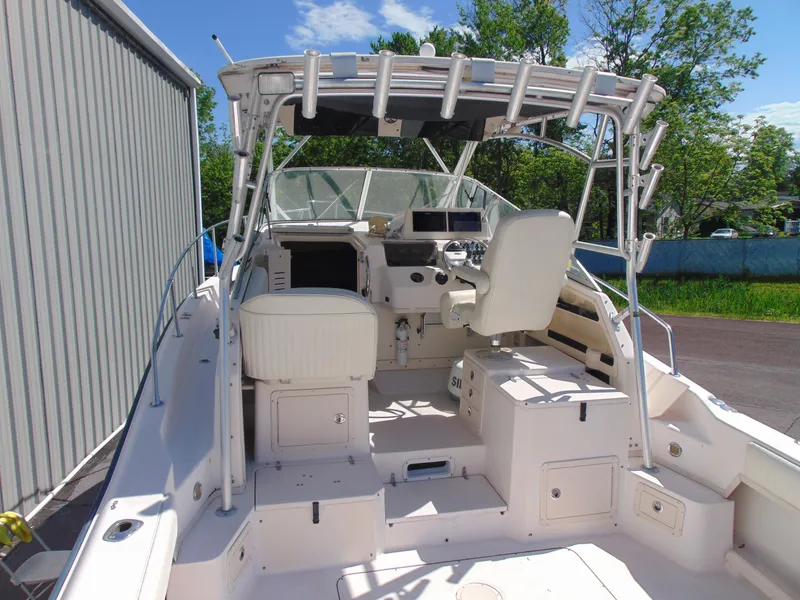Slide: The Image of 2002 Grady-White 30 Marlin WA boat interior with helm, seating, and storage compartments. - 8
