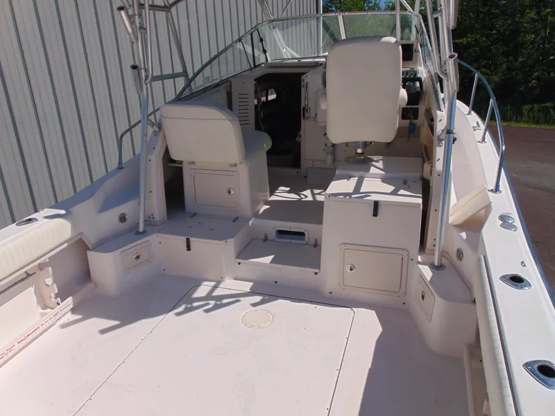 Slide: The Image of 2002 Grady-White 30 Marlin WA boat interior with seating and helm station. - 9