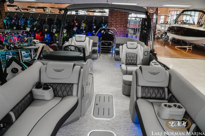Slide: The Image of 2025 Bennington 24LXSFB pontoon boat interior with luxurious seating at Lake Norman Marina. - 14