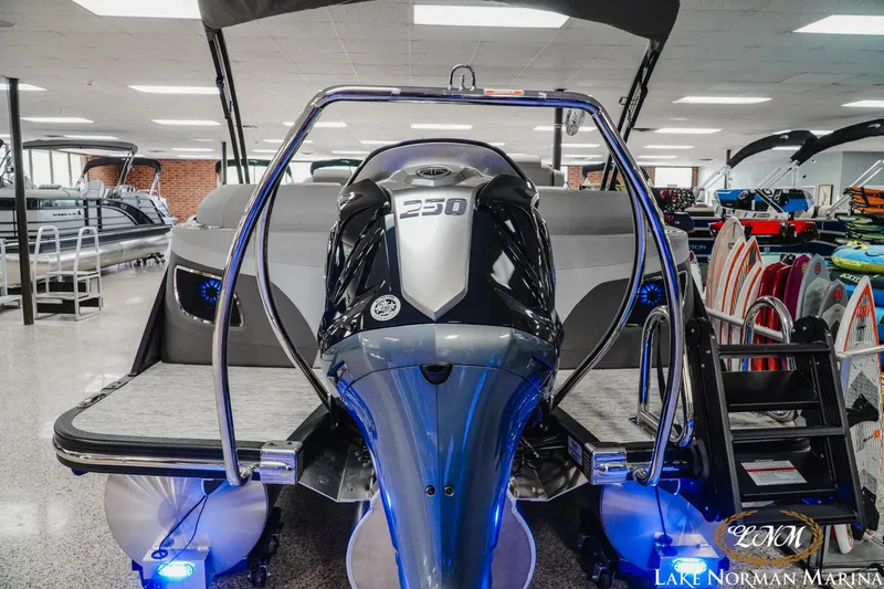 Slide: The Image of 2025 Bennington 24LXSFB boat with powerful 250 engine displayed at Lake Norman Marina. - 5