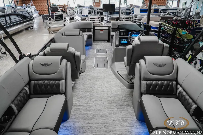 Slide: The Image of Interior of 2025 Bennington 24LXSFB pontoon boat with luxurious seating at Lake Norman Marina. - 6