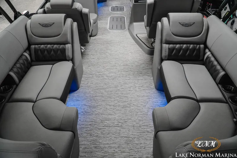 Slide: The Image of Luxurious interior of 2025 Bennington 24LXSFB pontoon boat with plush seating and ambient lighting. - 7