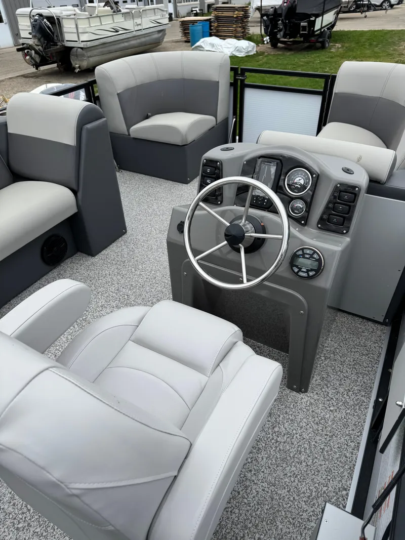 Slide: The Image of 2025 Angler Quest 816 Panfish Cruise boat interior with modern seating and steering console. - 12