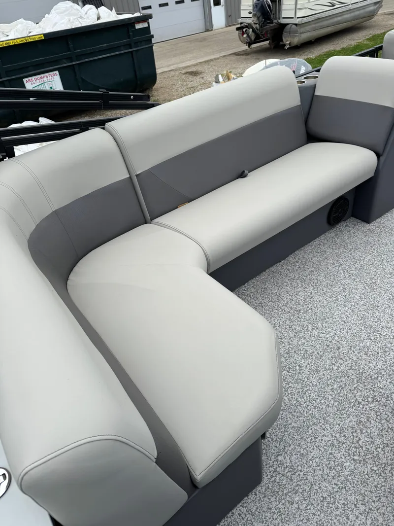 Slide: The Image of 2025 Angler Quest 816 Panfish Cruise boat with gray seating and carpeted floor. - 15