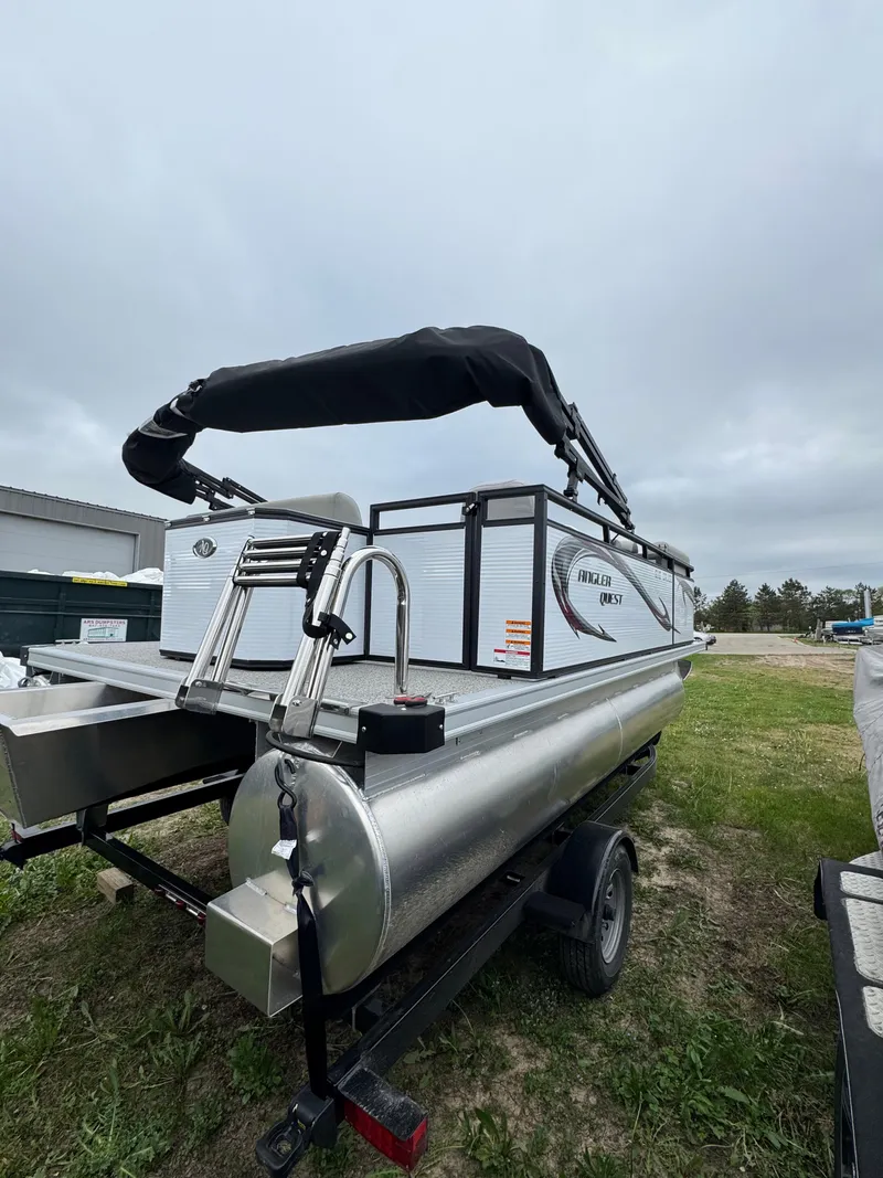 Slide: The Image of 2025 Angler Quest 816 Panfish Cruise pontoon boat on trailer, outdoor setting. - 4
