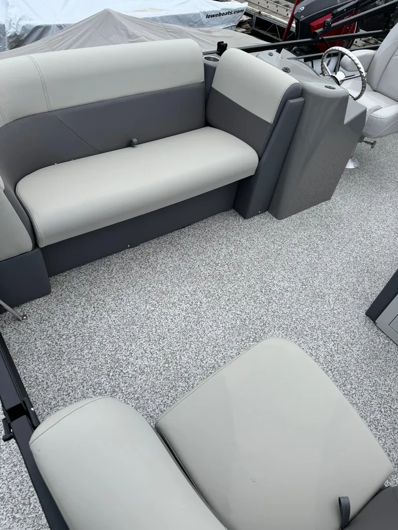 Slide: The Image of 2025 Angler Quest 816 Panfish Cruise interior with gray seating and textured flooring. - 5