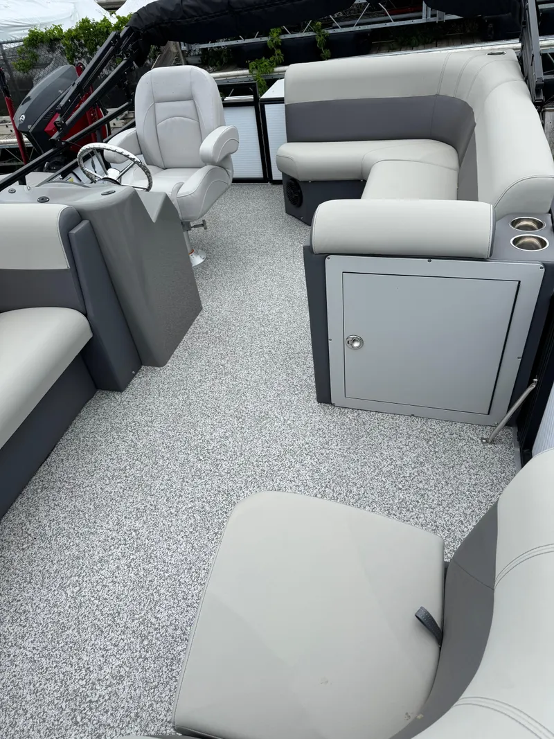 Slide: The Image of 2025 Angler Quest 816 Panfish Cruise interior with gray seating and textured flooring. - 6
