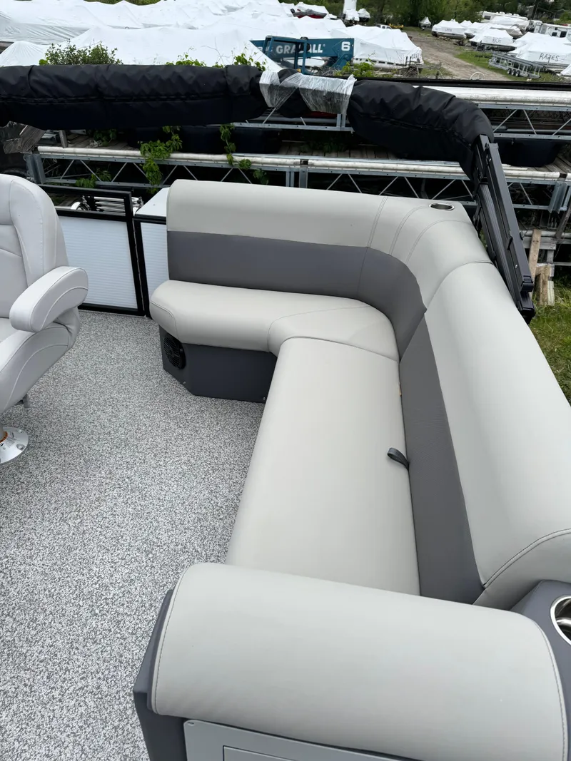 Slide: The Image of 2025 Angler Quest 816 Panfish Cruise boat with gray seating and spacious deck. - 7
