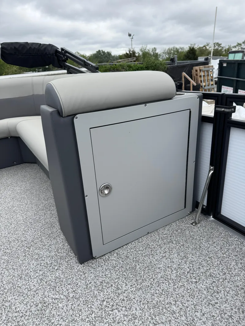 Slide: The Image of 2025 Angler Quest 816 Panfish Cruise boat with storage compartment and cushioned seating. - 8